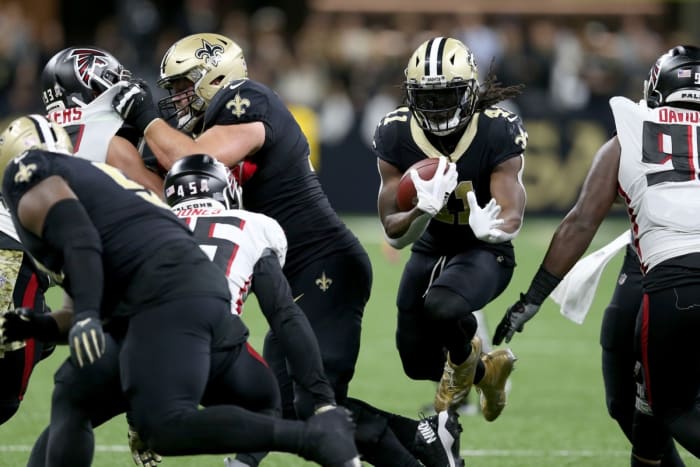 Nov 7, 2021; New Orleans Saints running back Alvin Kamara (41) jumps hits a hole against the Atlanta Falcons. Mandatory Credit: Chuck Cook-USA TODAY Sports